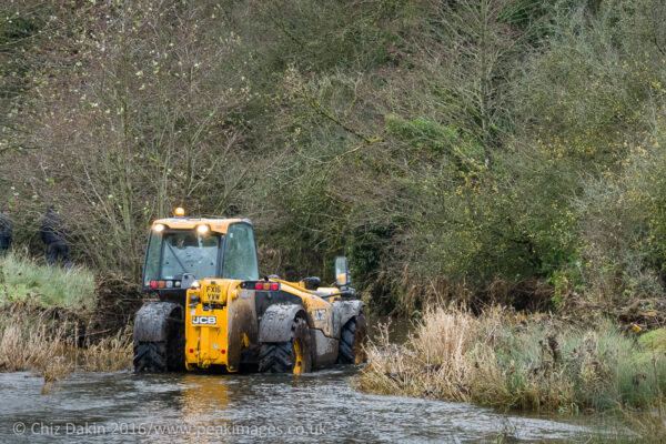 A JCB to the rescue as the Bradbourne Brook floated a courier transit van away downstream!